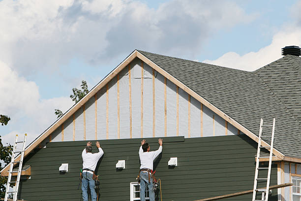 Professional Vinyl Siding technician working in Portland, IN